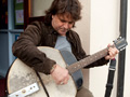 Tim Carter trying out a giant banjo